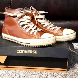 Brown leather converse